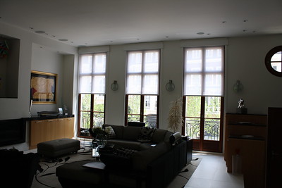 windows with white blinds viewed from bedroom